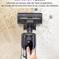 Hand holding a vacuum cleaner with LED touch panel on a wooden floor.